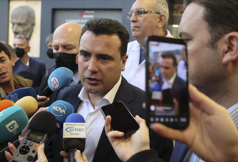 North Macedonia's Prime Minister Zoran Zaev speaks to media as he arrives to visit injured passengers at a hospital in Sofia, Bulgaria, Tuesday, Nov. 23, 2021 after a bus crash which killed at least 45 people, according to authorities, on a highway near the village of Bosnek, western Bulgaria. The bus, registered in Northern Macedonia, crashed around 2 a.m. and there were children among the victims, authorities said. (Vladimir Shokov/BTA Agency Bulgaria via AP)