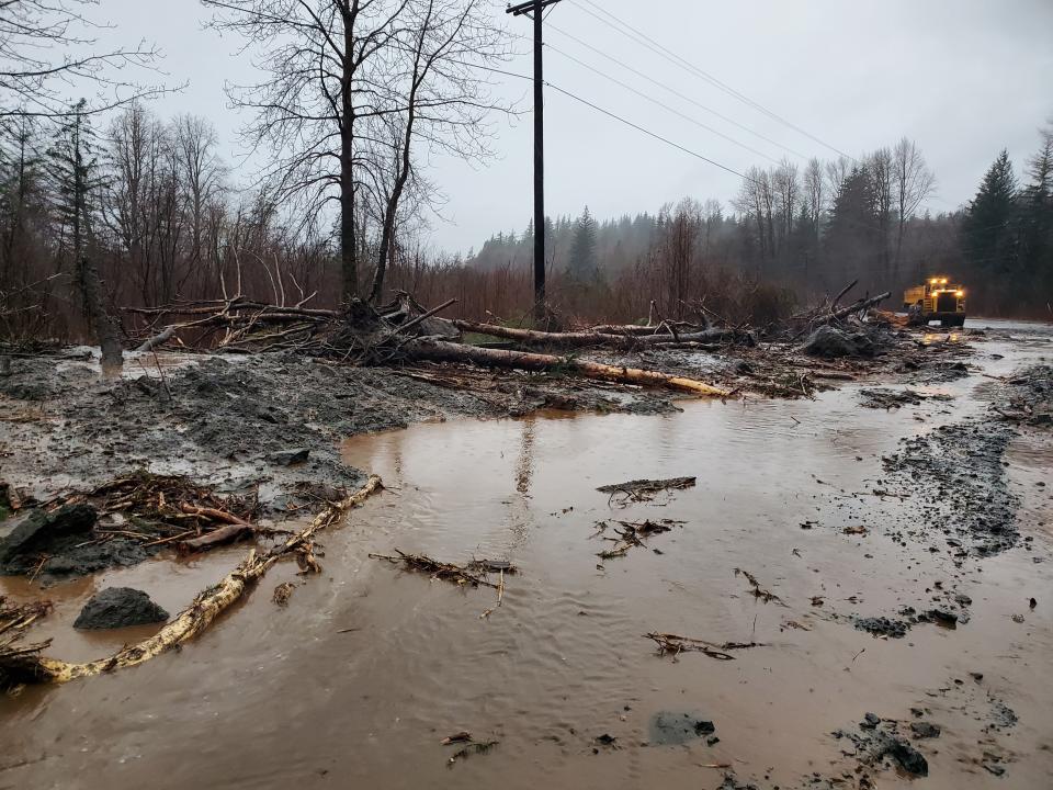 This photo provided by the Alaska Department of Transportation and Public Facilities shows damage from heavy rains and a mudslide 600 feet wide in Haines, Alaska, on Wednesday, Dec. 2, 2020. Authorities say six people are unaccounted for, and four homes were destroyed in the slide, with the search resuming Thursday morning for survivors. (Matt Boron/Alaska Department of Transportation and Public Facilities via AP)