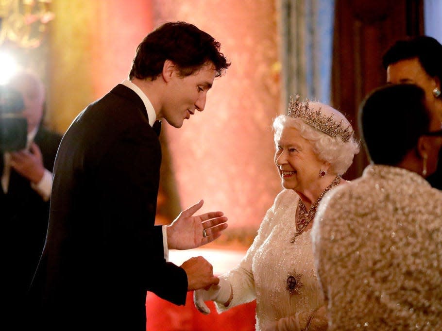 Queen Elizabeth shakes hands with Canadian Prime Minister Justin Trudeau