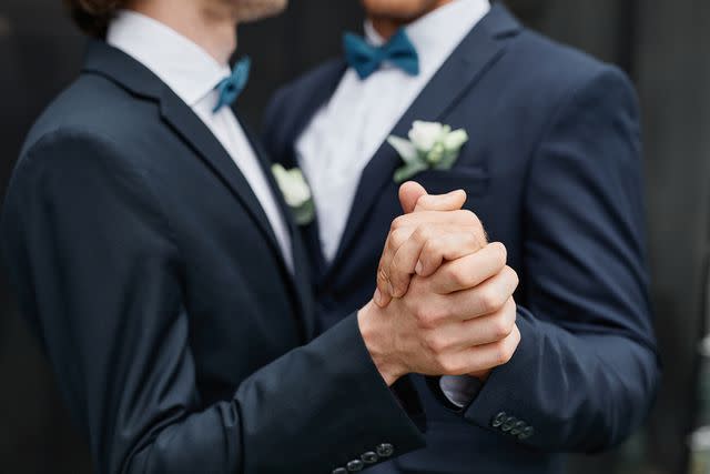 <p>Getty</p> Two grooms at wedding