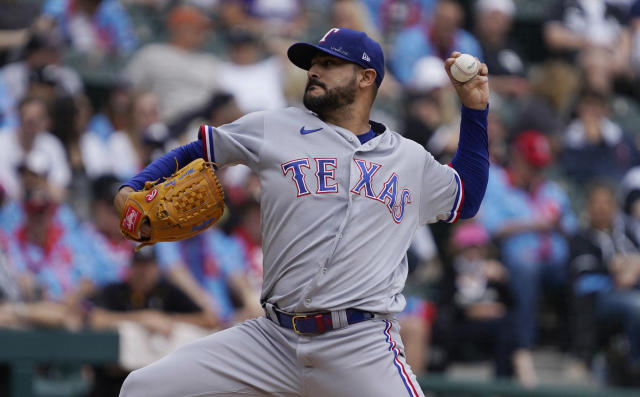 Texas Rangers pitcher Martin Perez (54) pitches against the New