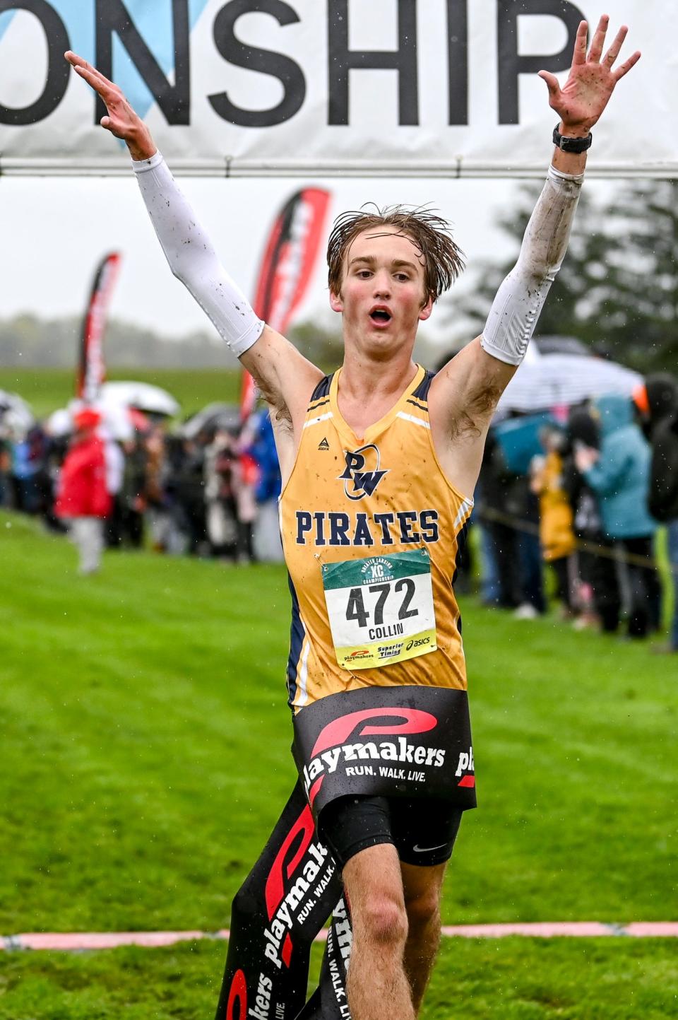 Pewamo-Westphalia's Collin Farmer celebrates after wining the boys Greater Lansing Cross Country Championships on Saturday, Oct. 14, 2023, at Ledge Meadows Golf Course in Grand Ledge.