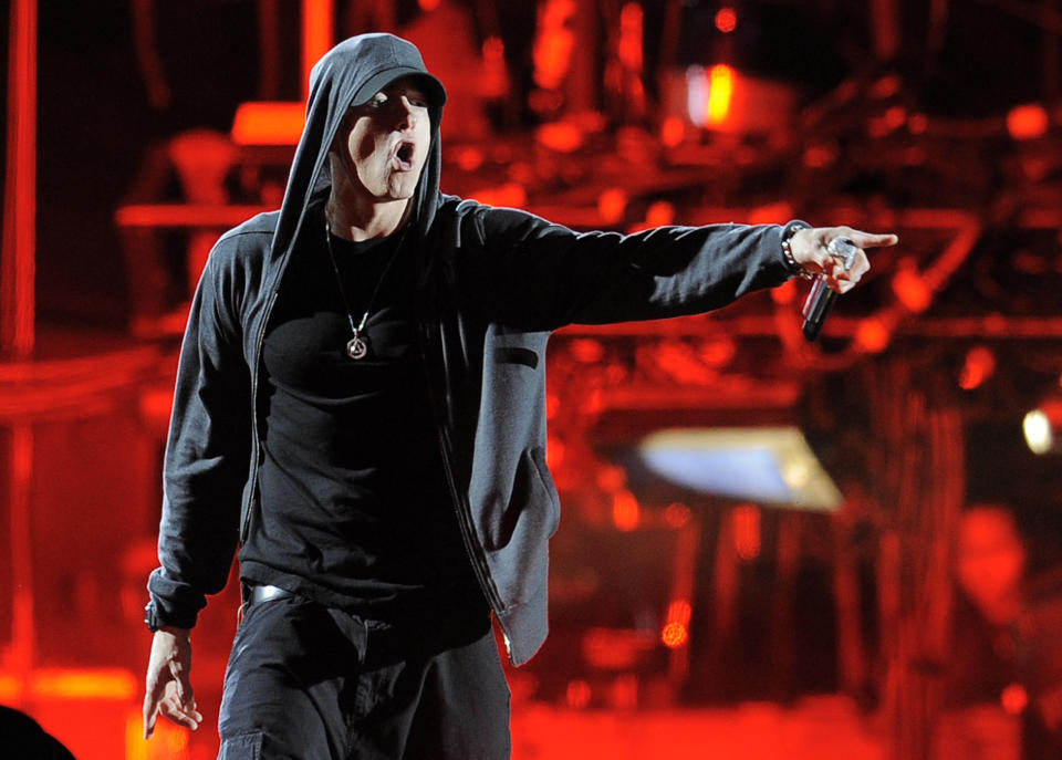 FILE - This April 15, 2012 file photo shows Eminem performing at the 2012 Coachella Valley Music and Arts Festival in Indio, Calif. Eminem and Outkast will headline this year’s Lollapalooza music festival on Aug. 1-3, 2014, in Chicago. Festival founder Perry Farrell announced the lineup of more than 130 acts on Wednesday, March 26, 2014. (AP Photo/Chris Pizzello, File)