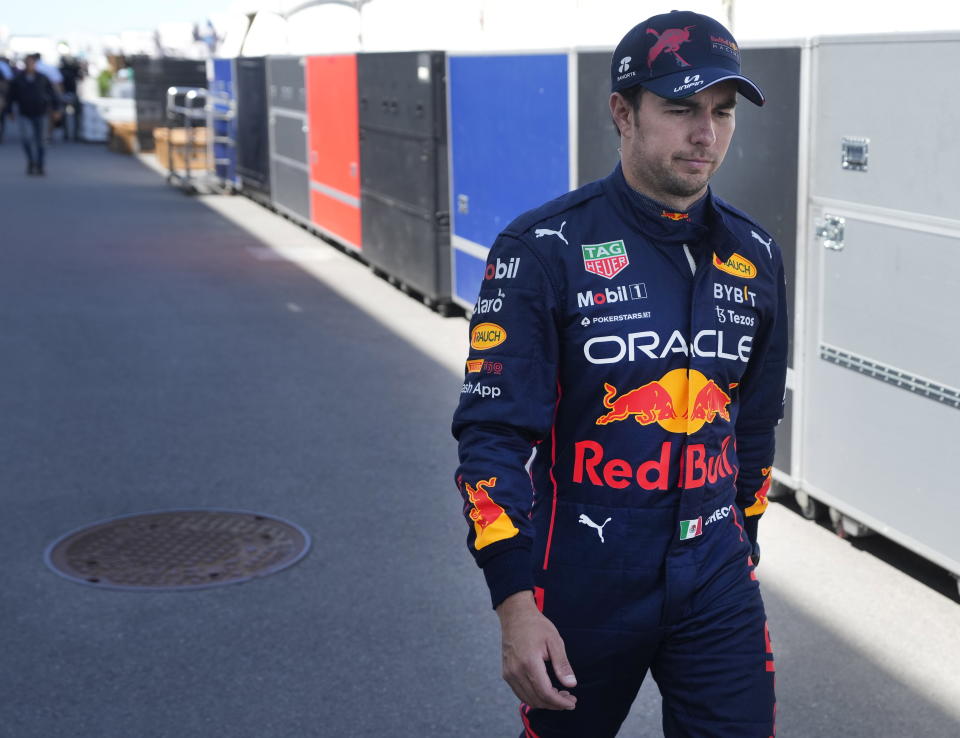 Red Bull Racing's Sergio Perez, of Mexico, walks through the paddock after his car failed during the Canadian Grand Prix auto race in Montreal, Sunday, June 19, 2022. (Ryan Remiorz/The Canadian Press via AP)