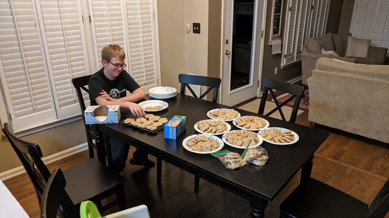 Fletcher's Elliott Stay, an eighth grader at Christ School, makes his plates for a bake sale he is doing to raise funds for earthquake victims in Turkey and Syria.