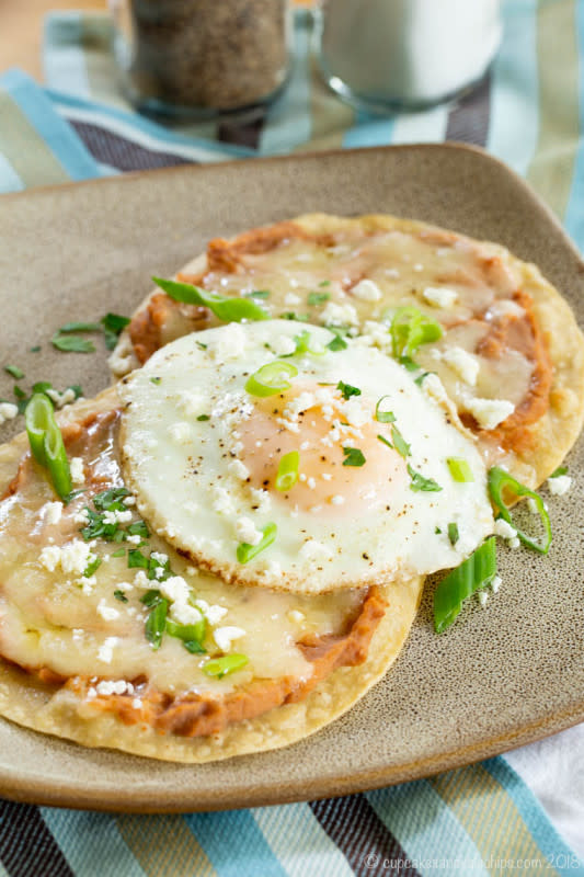 <p>Cupcakes & Kale Chips</p><p>Fried eggs and refried beans on crisp corn tortillas make this a perfect Cinco de Mayo breakfast or brinner. Get this <a href="https://cupcakesandkalechips.com/breakfast-tostada-stacks/" rel="nofollow noopener" target="_blank" data-ylk="slk:Breakfast Tostada Stacks;elm:context_link;itc:0;sec:content-canvas" class="link rapid-noclick-resp">Breakfast Tostada Stacks</a> recipe!</p>