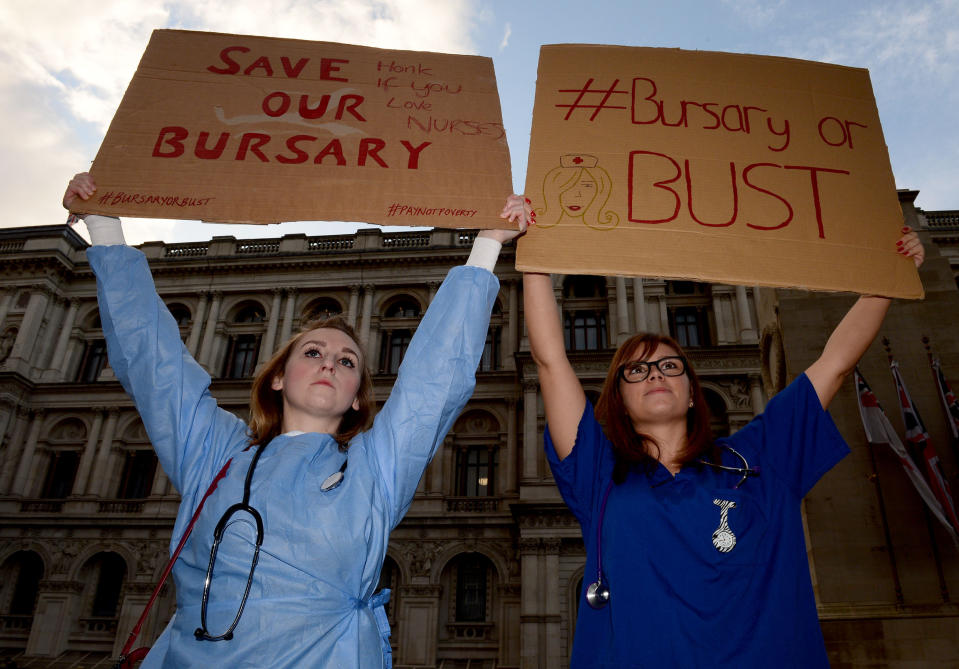 Student midwives and nurses stage a protest over the scrapping of bursaries outside the Department of Health in London.