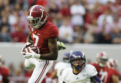 Alabama wide receiver Cam Sims (7) catches the ball against Western Carolina linebacker Daniel Riddle (58) during the first half of an NCAA college football game, Saturday, Nov. 22, 2014, in Tuscaloosa, Ala. (AP Photo/Brynn Anderson)