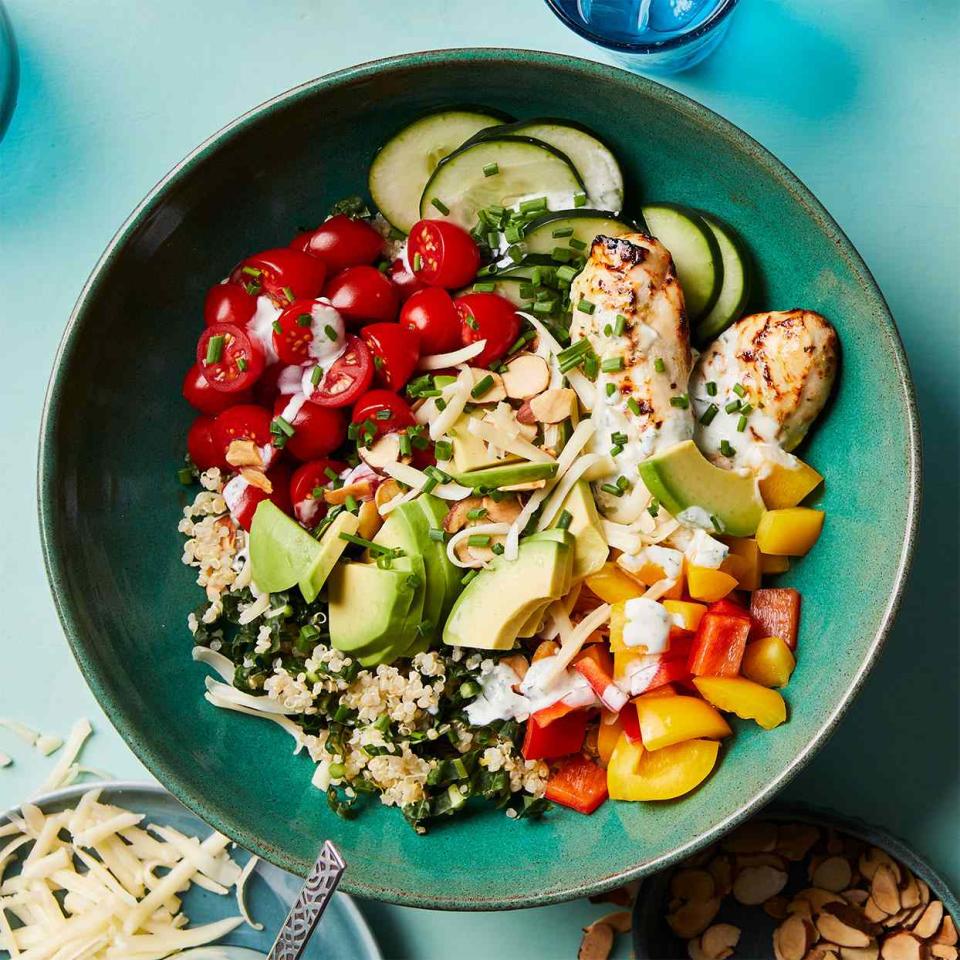 <p>Dark green dinosaur kale contrasts with the warm tones of bell peppers and tomatoes in these hearty chicken and veggie bowls. <a href="https://www.eatingwell.com/recipe/279106/goddess-veggie-bowls-with-chicken/" rel="nofollow noopener" target="_blank" data-ylk="slk:View Recipe" class="link ">View Recipe</a></p>