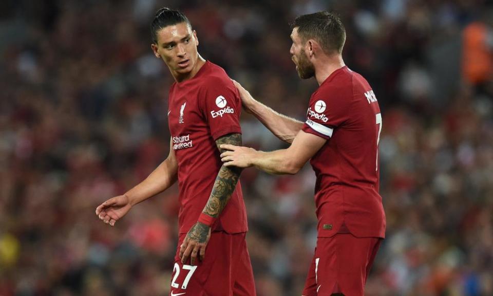 Liverpool’s Darwin Núñez leaves the pitch after he is sent off as Liverpool’s James Milner looks on in the Premier League match against Crystal Palace.