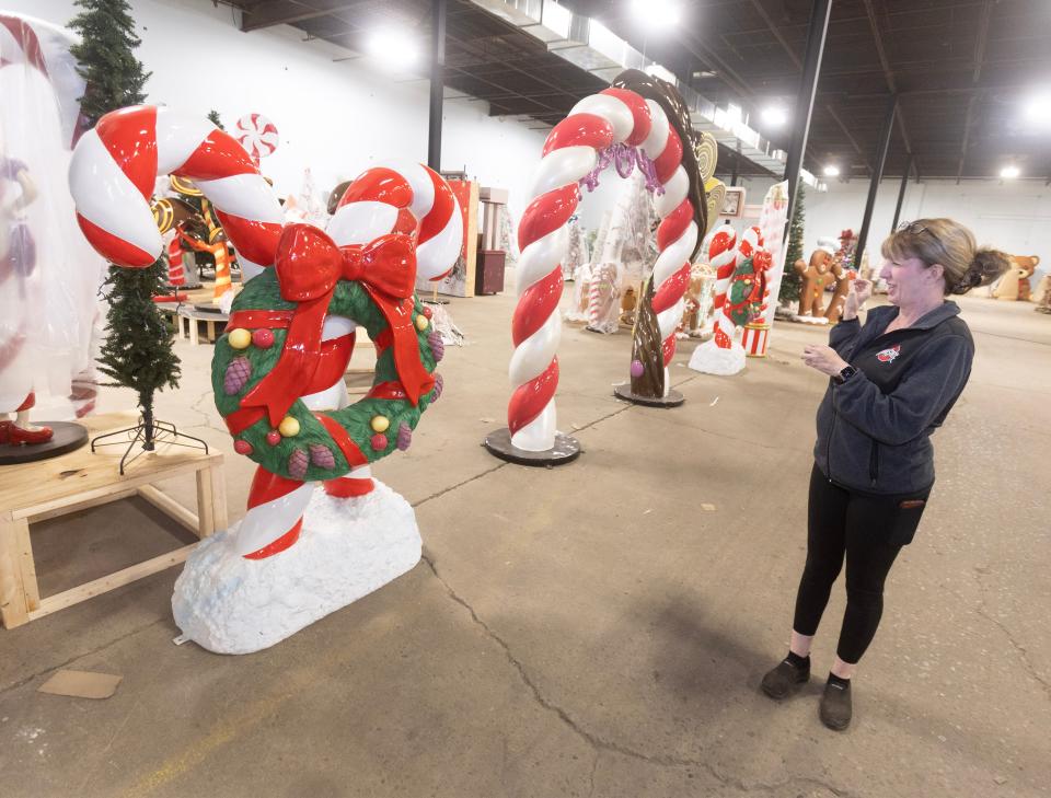 Kim Shapiro, bar manager at the Factory of Terror in Canton, shows props for the new, all-ages Christmas attraction, which opens on Nov. 24.