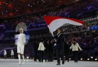 Monaco's flag-bearer Olivier Jenot leads his country's contingent during the opening ceremony of the 2014 Sochi Winter Olympic Games February 7, 2014. REUTERS/Brian Snyder (RUSSIA - Tags: SPORT OLYMPICS)