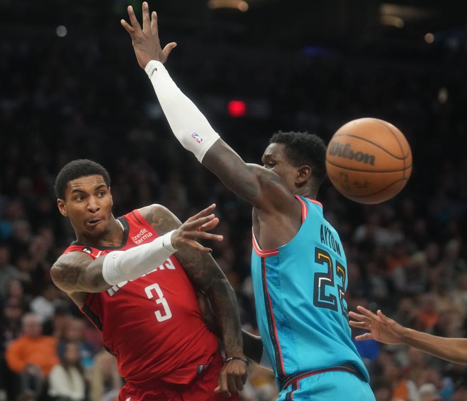 Dec 2, 2022; Phoenix, AZ, USA; Phoenix Suns center Deandre Ayton (22) defends a pass by Houston Rockets guard Kevin Porter Jr.(3) at Footprint Center. Mandatory Credit: Joe Rondone-Arizona Republic