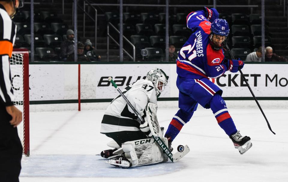 MSU goalie Dylan St. Cyr protects the net against Brian Chambers of UMass-Lowell  Thursday, Oct. 13, 2022, at Munn Ice Arena in East Lansing.