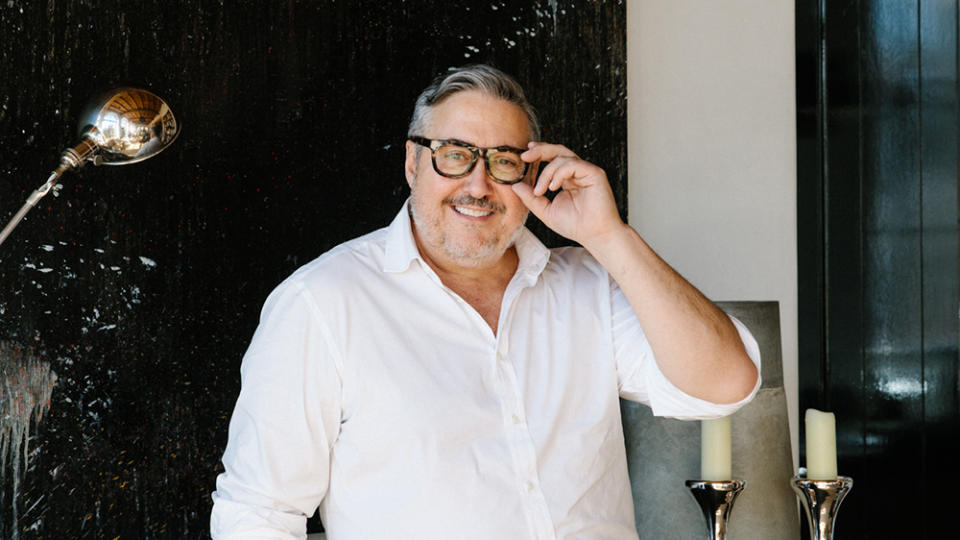 The interior designer pictured in his East Village duplex. - Credit: Laurel Golio