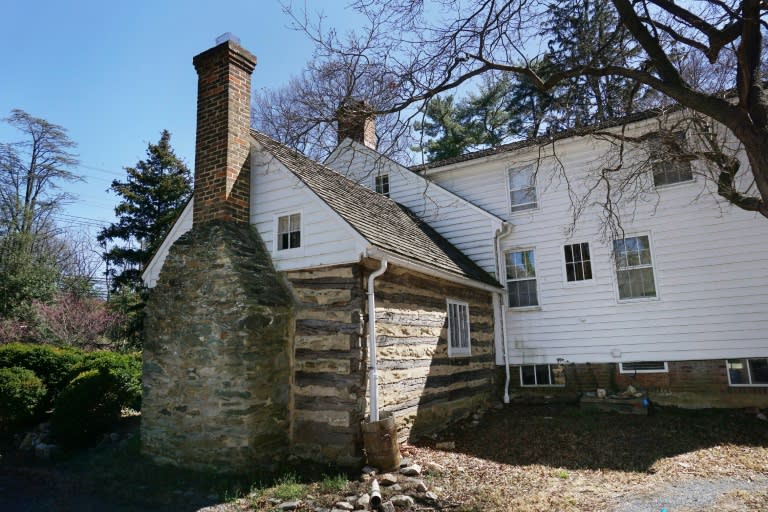 A photo taken on March 29, 2017 shows the log cabin structure which was originally used as a kitchen, next to the plantation house at Josiah Henson Park in Bethesda, Maryland