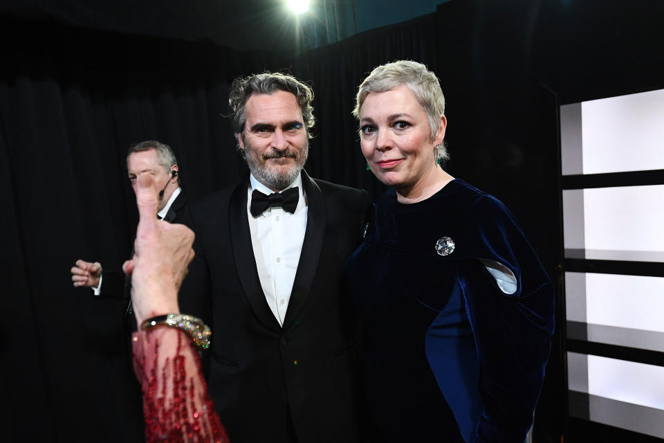 HOLLYWOOD, CALIFORNIA - FEBRUARY 09: In this handout photo provided by A.M.P.A.S. Best Actor award winner Joaquin Phoenix and Olivia Colman stand backstage during the 92nd Annual Academy Awards at the Dolby Theatre on February 09, 2020 in Hollywood, California. (Photo by Richard Harbaugh - Handout/A.M.P.A.S. via Getty Images)