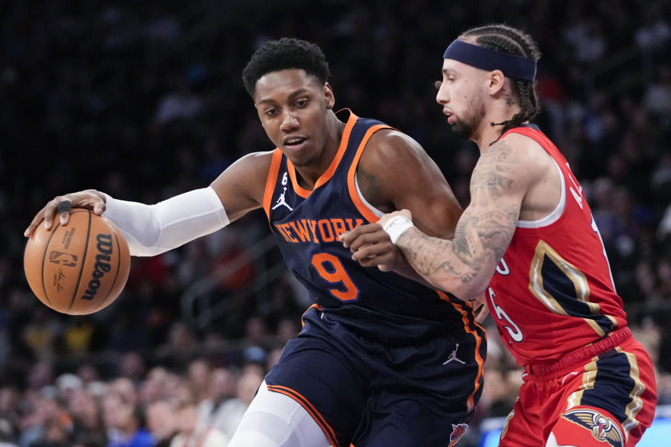 New York Knicks guard RJ Barrett (9) drives to the basket against New York Knicks guard Immanuel Quickley (5) during the first half of an NBA basketball game, Saturday, Feb. 25, 2023, at Madison Square Garden in New York. (AP Photo/Mary Altaffer)