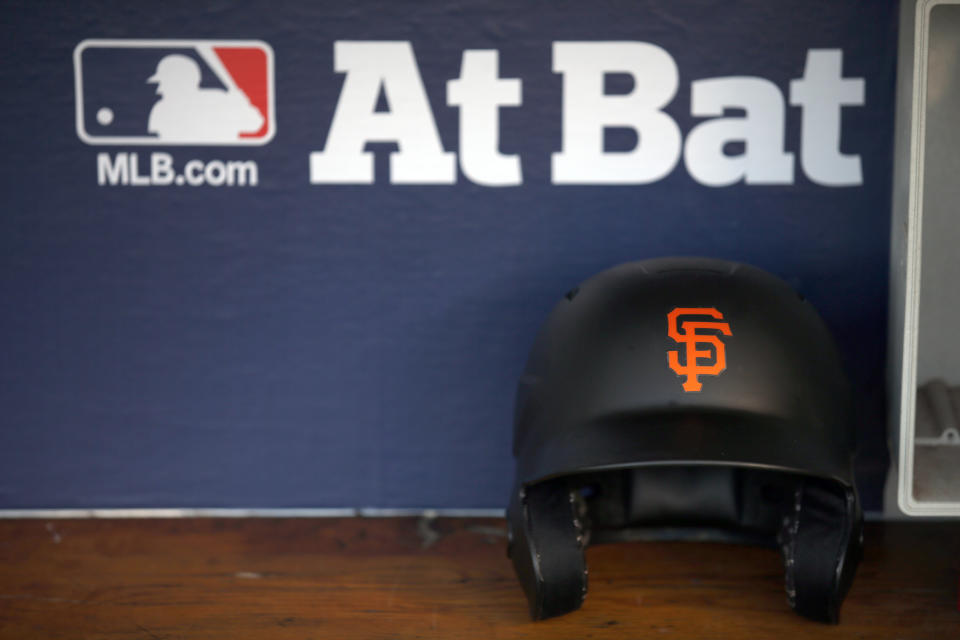 A San Francisco Giants helmet sits in the dugout before Game 2 of baseball's National League Division Series against the Chicago Cubs, Saturday, Oct. 8, 2016, in Chicago. (AP Photo/Nam Y. Huh)