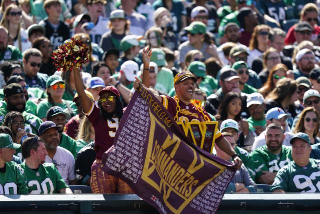 Chicago Bears fans cheer on their team during the second half of an NFL  football game against t …