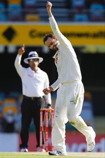 Australian bowler Nathan Lyon punches the air after claiming the wicket of South African batsman Jacques Rudolph on day five of their first Test. Rudolph ultimately went lbw to Lyon for 11 heading into the final hour