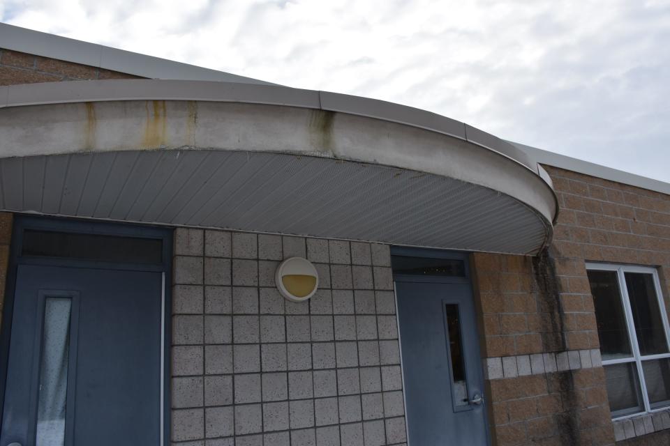 Canopies above exterior doors in the elementary/middle school wing at Alanson Public School are rusting and coming apart, and are not functioning properly, causing mold issues. The canopies would be removed with proceeds from the bond proposal, according to Superintendent Rachelle Cook.