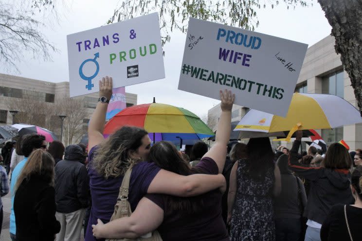 Supporters gather for a rally outside the North Carolina State Capitol in Raleigh on April 11, 2016, in support of a law that blocks rules allowing transgender people to use public bathrooms aligned with their gender identity. (Photo: Gerry Broome/AP)