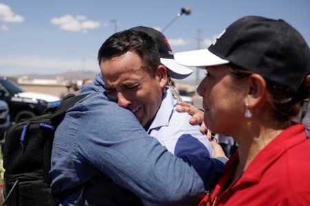 A Tv news reporter gets emotional at the site of a mass shooting where 20 people lost their lives at a Walmart in El Paso