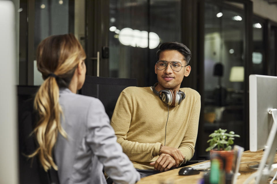 two people talking in the office