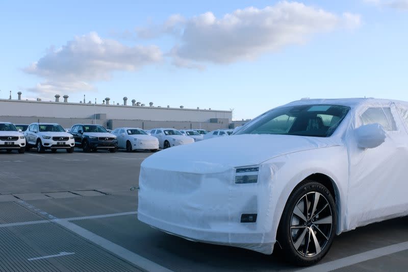 Polestar electric vehicle for export is seen in front of Volvo sport utility vehicles at a Geely plant in Taizhou