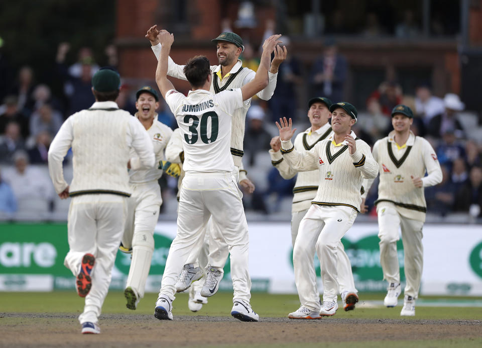 MANCHESTER, ENGLAND - SEPTEMBER 07: Pat Cummins of Australia celebrates with Nathan Lyon of Australia after taking the wicket of Rory Burns of England during day four of the 4th Specsavers Test between England and Australia at Old Trafford on September 07, 2019 in Manchester, England. (Photo by Ryan Pierse/Getty Images)