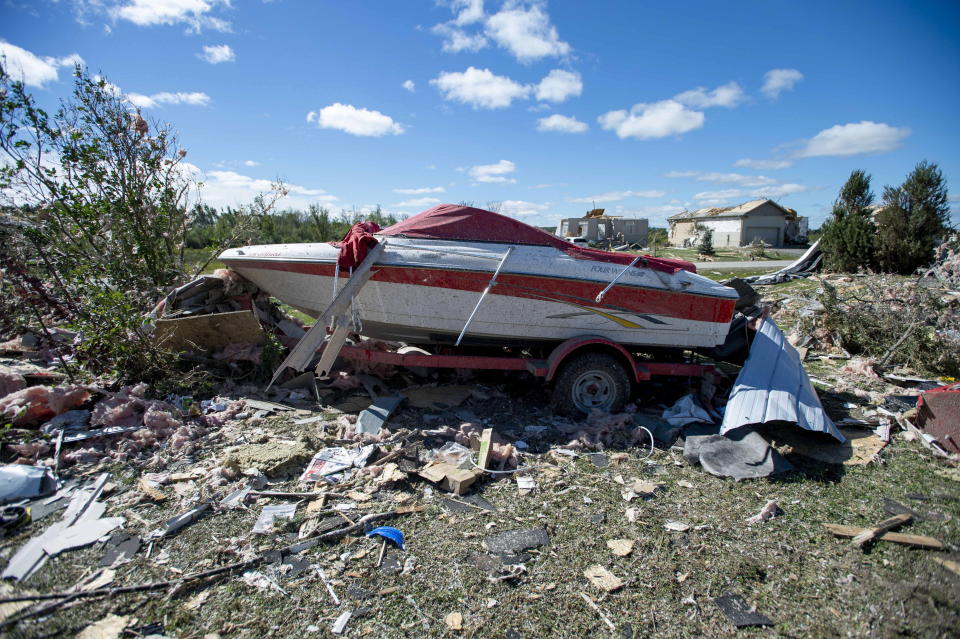 <p>A boat is surrounded by rubble in a neighbourhood destroyed by a tornado in Dunrobin, Ont., west of Ottawa, on Saturday, Sept. 22, 2018. The storm tore roofs off of homes, overturned cars and felled power lines in the Ottawa community of Dunrobin and in Gatineau, Que. (Photo from Justin Tang/The Canadian Press) </p>