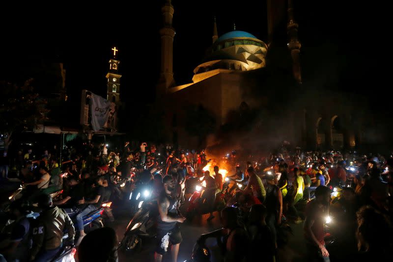 Demonstrators ride on motorbikes during a protest against fall in Lebanese pound currency and mounting economic hardship in Beirut