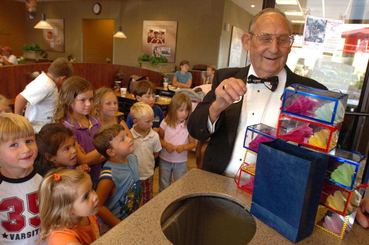 Esty Davis Jr. performs a magic trick for children at the Chick-fil-A at Mayfaire in 2008. Davis died in 2015.