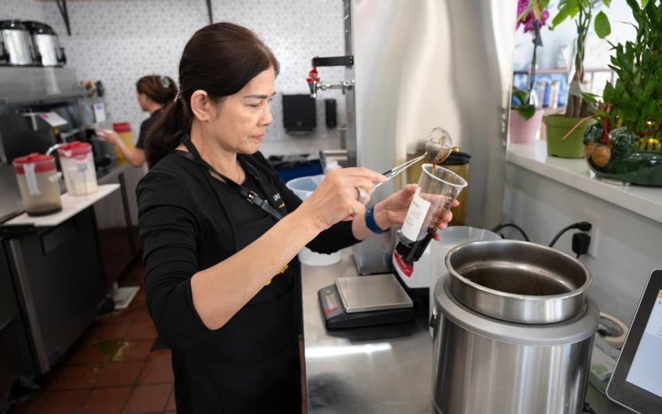Lanh Tonnu prepares a boba tea drink at Teaspoon cafe in Modesto, Calif., Tuesday, April 9, 2024.