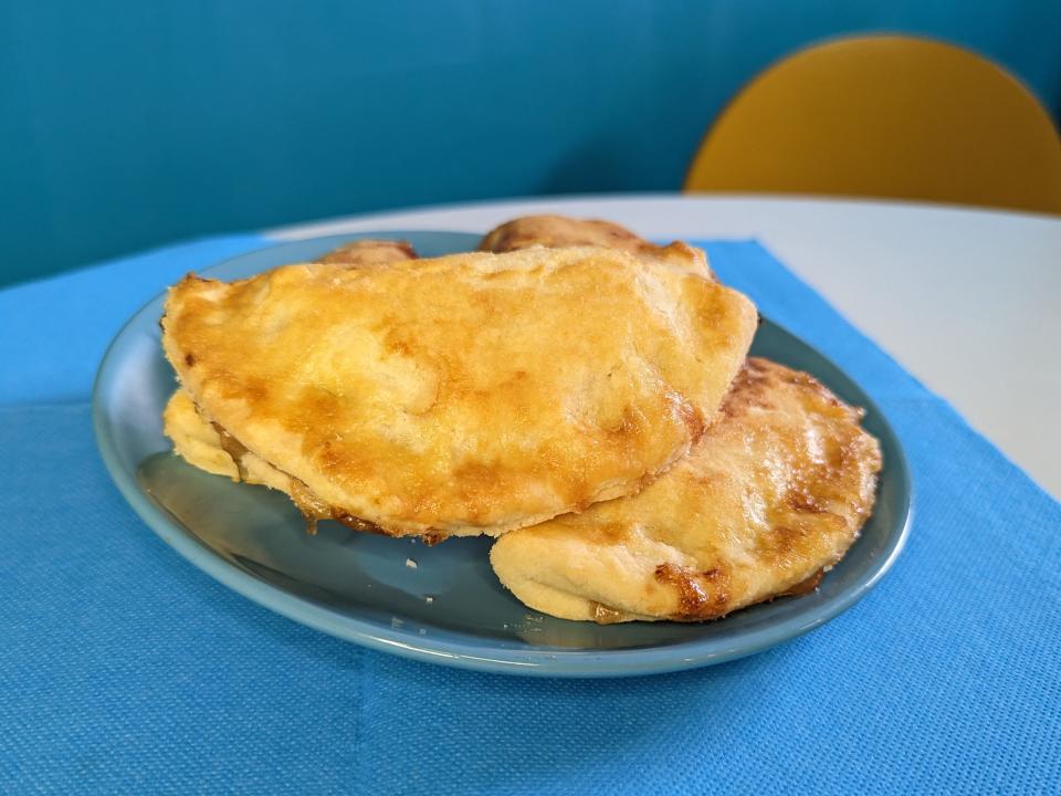 blue plate with two air fried apple fry pies