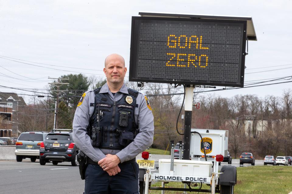 Holmdel Patrolman Matthew Menosky, who started the traffic enforcement program, Goal: Zero, in honor of his friend's brother who was killed at the age of 16 by a drunk driver in Middletown, stands along Route 35 North in Holmdel, NJ Tuesday, March 26, 2024. Fourteen police agencies will take part in the traffic enforcement detail along Route 35 from 3 p.m. to 7 p.m. on Wednesday, March 27.