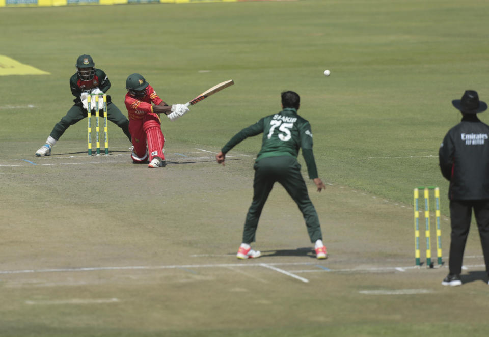 Zimbabwe batsman Wessly Madhevere plays a shot, during the second One Day International series cricket match between Zimbabwe and Bangladesh, at Harare Sports Club, in Harare, Sunday, July 18, 2021. (AP Photo/Tsvangirayi Mukwazhi)
