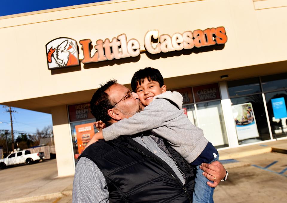 Vinnie Patel, photographed with his son Prem on Thursday, January 13, 2022, decided to get into business with his brother, Neil Patel. The pair now own 14 Little Caesars stores throughout Texas and Louisiana, including one in Shreveport.