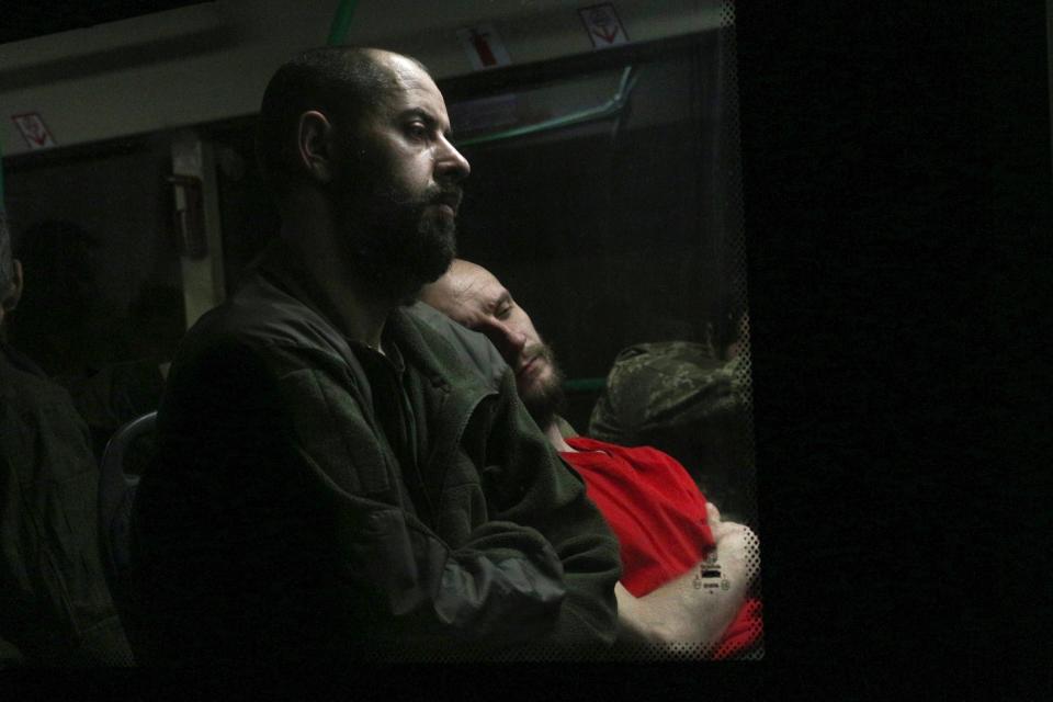 Ukrainian soldiers sit on a bus after leaving Azovstal (Copyright 2022 The Associated Press. All rights reserved.)