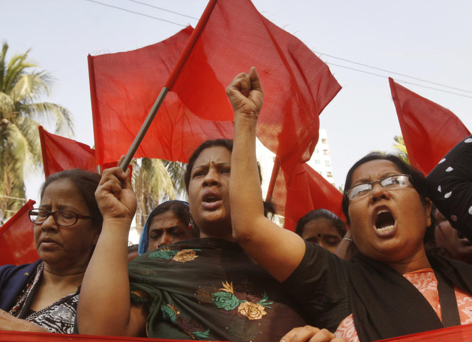 Bangladeshi garment workers shout slogans as they participate in a protest to mourn the death of the victims of a fire in a garment factory in Dhaka, Bangladesh, Friday, Nov. 30, 2012. Hundreds of garment workers protested Friday outside the Bangladeshi factory where 112 people were killed by the fire, demanding compensation for their lost salaries. (AP Photo/Pavel Rahman)