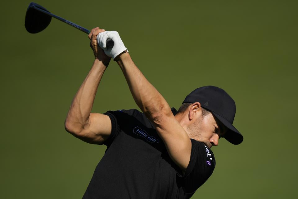 Camilo Villegas, of Colombia, hits on the practice range during a practice round in preparation for the Masters golf tournament at Augusta National Golf Club Monday, April 8, 2024, in Augusta, Ga. (AP Photo/Matt Slocum)