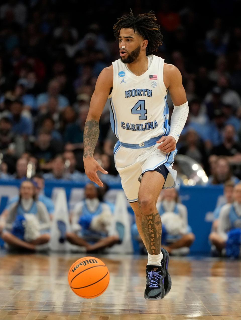 North Carolina Tar Heels guard RJ Davis (4) controls the ball against the Wagner Seahawks in the first round of the 2024 NCAA Tournament at the Spectrum Center.
