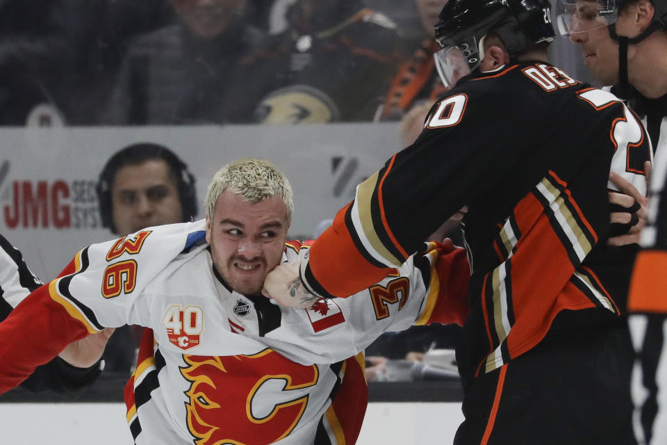 Calgary Flames center Zac Rinaldo, left, and Anaheim Ducks left wing Nicolas Deslauriers fight during the first period of an NHL hockey game in Anaheim, Calif., Thursday, Feb. 13, 2020. (AP Photo/Chris Carlson)