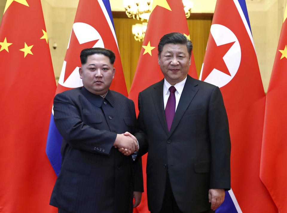 Kim Jong Un AND Xi Jingping (Xinhua/Ju Peng)(mcg)