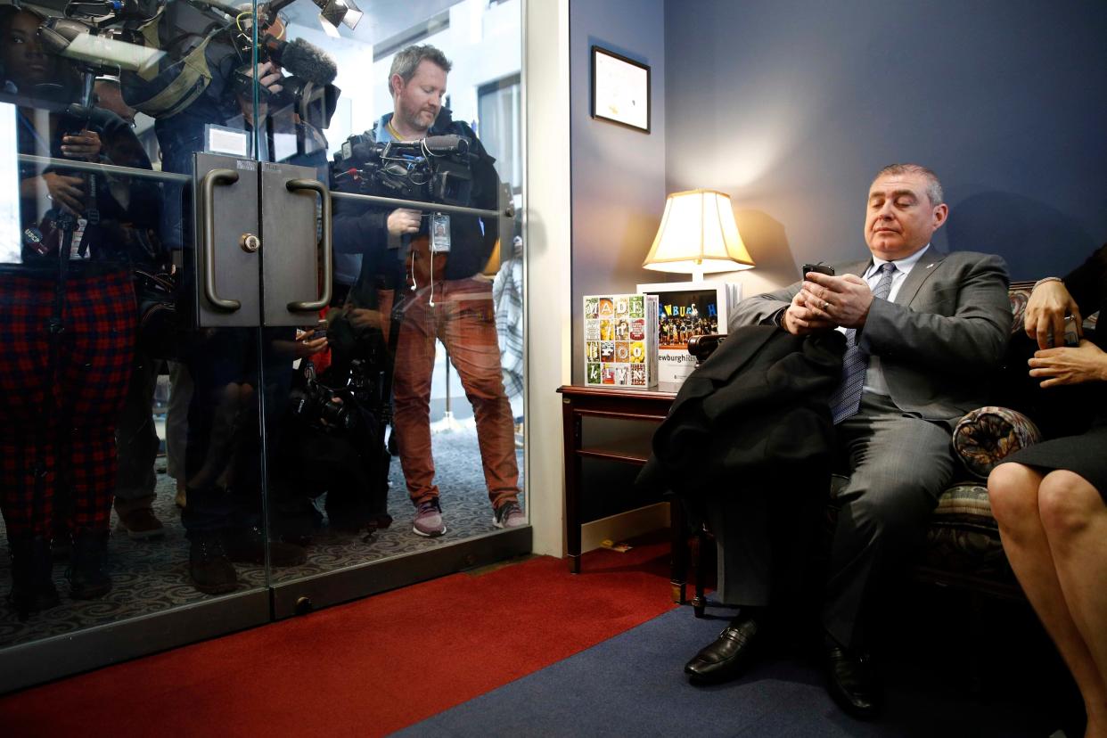 Lev Parnas looking through his phone while visiting Capitol Hill. 