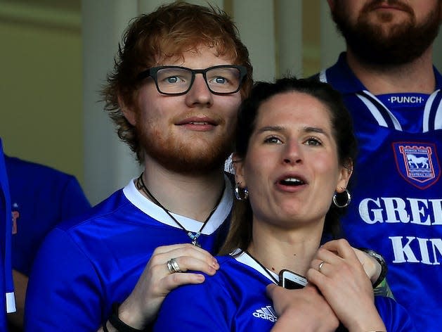 Musician Ed Sheeran and fiance Cherry Seaborn look on during the Sky Bet Championship match between Ipswich Town and Aston Villa at Portman Road on April 21, 2018 in Ipswich, England. (Photo by Stephen Pond/Getty Images)