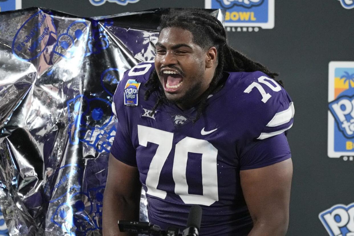 Kansas State offensive lineman KT Leveston celebrates.