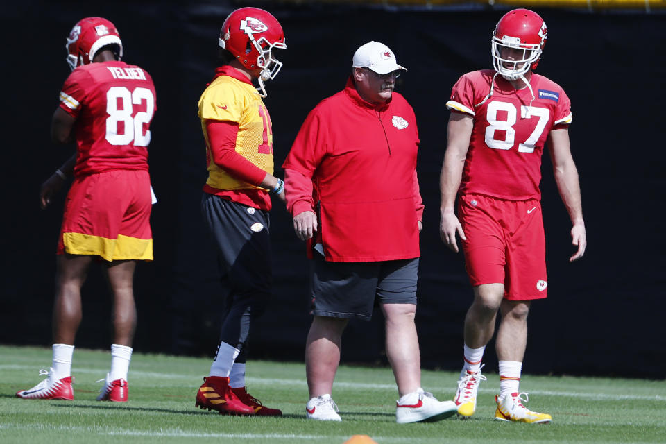 Kansas City Chiefs quarterback Patrick Mahomes (15) and tight end Travis Kelce (87) walk with head coach Andy Reid during practice on Thursday, Jan. 30, 2020, in Davie, Fla., for the NFL Super Bowl 54 football game. (AP Photo/Brynn Anderson)