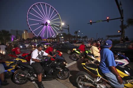 Motorcycles and cars battle for lanes along Ocean Boulevard in Myrtle Beach, South Carolina in this May 25, 2012 file photo. REUTERS/Randall Hill/Files